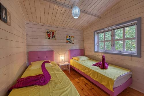 Ένα ή περισσότερα κρεβάτια σε δωμάτιο στο Chalet de Christine