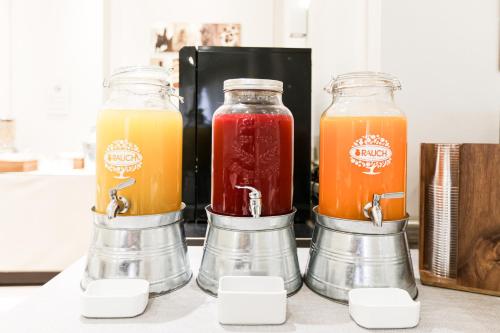two mason jars filled with different types of juice at Albergo Firenze in Florence