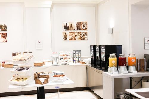 a room with a counter with food items on it at Albergo Firenze in Florence