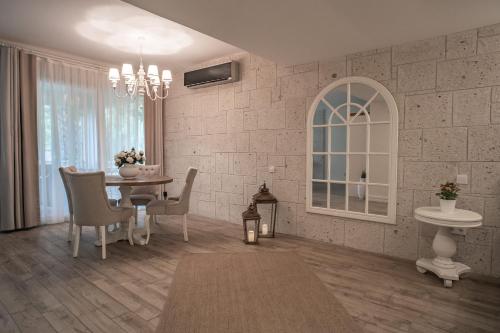 a rendering of a living room with a table and chairs at Mark Warner Phokaia Beach Resort in Foca