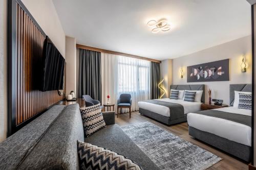 Postel nebo postele na pokoji v ubytování Hotel Bristol