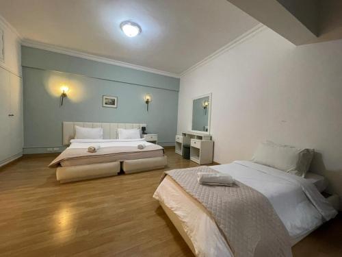 Elegant Suites Beirutにあるベッド