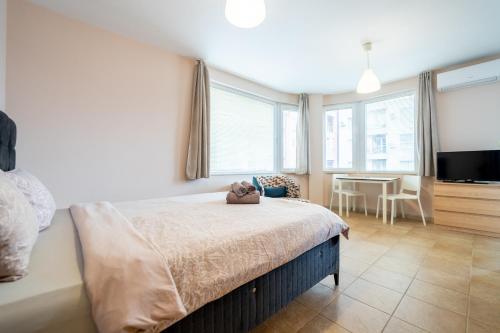 A bed or beds in a room at Lovely apartment in Studentski grad