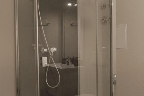 a bathroom with a shower and a sink at Apartment Göhrenglück - groß - zentral - strandnah in Göhren