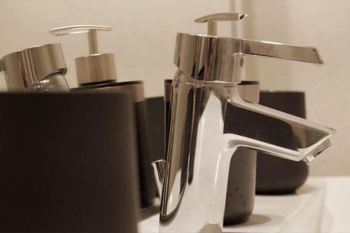a close up of a bathroom sink with two faucets at Apartment Göhrenglück - groß - zentral - strandnah in Göhren