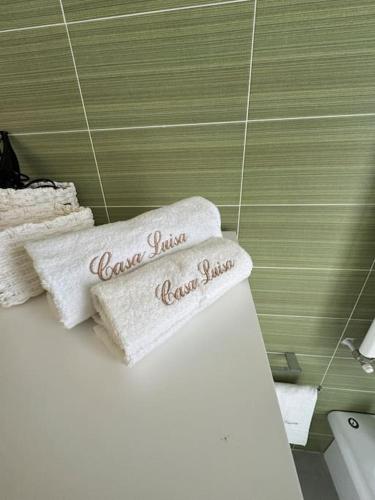 two towels on top of a bed in a bathroom at CASA LUISA - Comfortable APT in San Vitaliano 