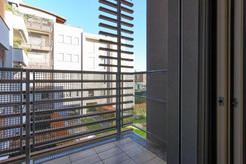 a balcony with a view of a building at CaseOspitali - Casa Marina grande bilocale con terrazzo perfetto x2 in Cernusco sul Naviglio