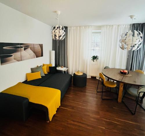 a living room with a bed and a table at Apartment M4 in Salzburg