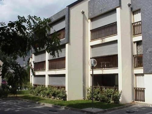 a white building with balconies on the side of it at Résidence Aurette Pic Long - RESIDENCE AURETTE à deux pas du centre MAE-6134 in Saint-Lary-Soulan