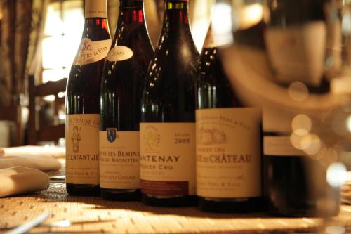 a group of bottles of wine sitting on a table at La Flambée in Sennecey-lès-Dijon