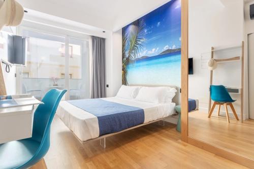 a hotel room with a bed and a view of the ocean at Hibrido Boutique Hotel & Spa in Sciacca