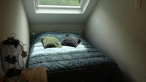a small bed in a small room with a window at Résidence Le Palos - A deux pas du téléphérique Résidence PALOS appartement 6 personnes MAE-0754 in Cadeilhan-Trachère