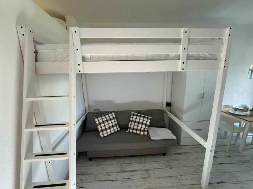a white bunk bed with two pillows in a room at Casa Bruno in Marciana