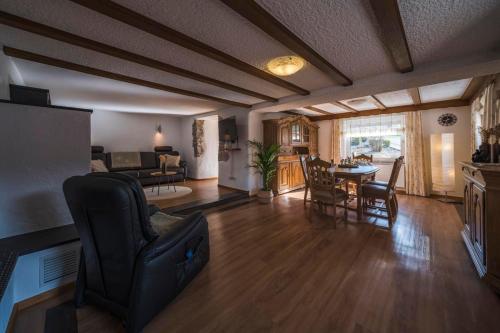 a living room with a couch and a table at Das Schmitz Haus in Meckel