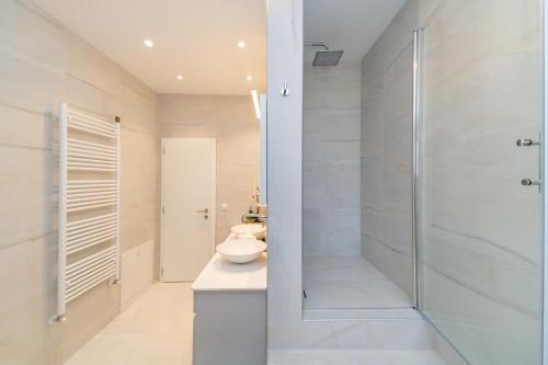 a bathroom with a shower and a toilet and a sink at Holiday Home Kiara in Brtonigla