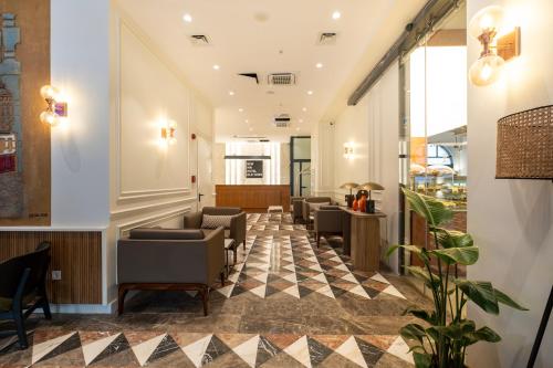 a lobby with couches and chairs in a building at New Inn Hotel Old Town in Istanbul