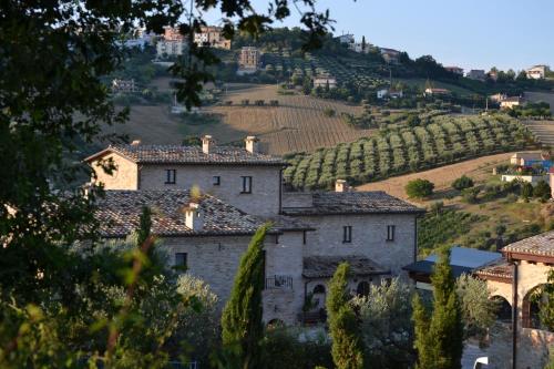 a view of a village with a vineyard at Agriturismo Il Sapore Della Luna in Monteprandone