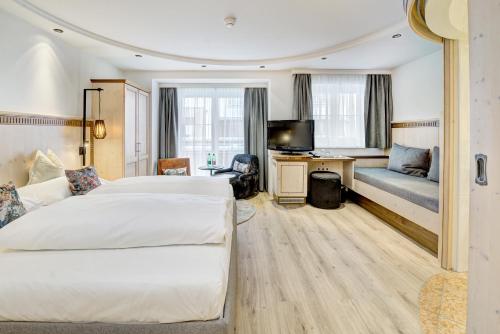 Un ou plusieurs lits dans un hébergement de l'établissement Hotel Brigitte