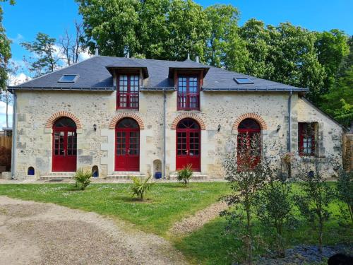 an old stone house with red doors at Château de Jallanges & Spa à Vouvray - 1h de spa incluse par jour in Vouvray
