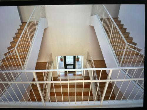 an overhead view of a staircase in a building at Comosole in Como