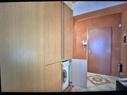 a bathroom with a washer and dryer in a room at Cernobbio lake suites in Cernobbio