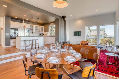 a dining room and living room with a table and chairs at Walters Waldport in Waldport