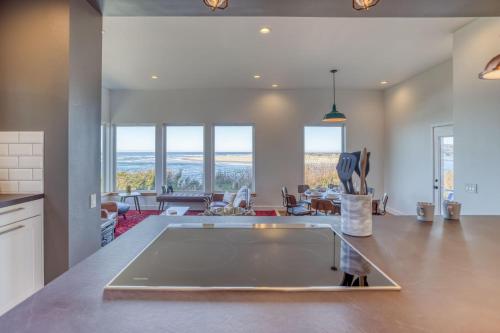 a kitchen and living room with a view of the ocean at Walters Waldport in Waldport