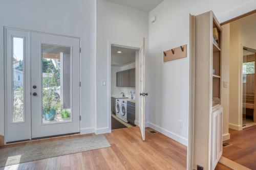 an open living room with white walls and wooden floors at Walters Waldport in Waldport