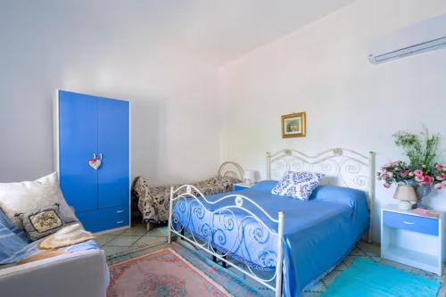 A bed or beds in a room at Casa della Cupa