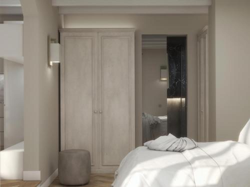 Un pat sau paturi într-o cameră la La Corte Luxury Apartment - BRERA