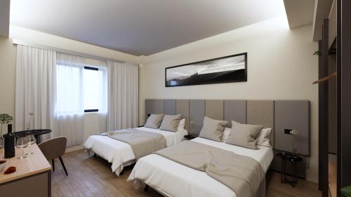 a hotel room with two beds and a window at Acca Sporting Milano - AA Hotels in Opera