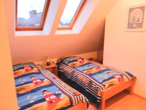 Postel nebo postele na pokoji v ubytování Fewo Friesennest-Greetsiel