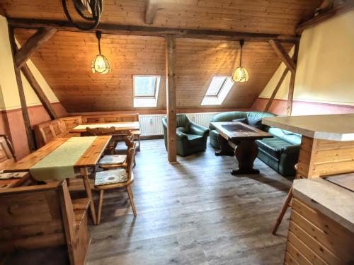 a living room with a couch and a table at Pension Claudia Güldenpfennig in Tangermünde