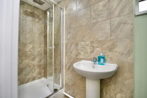 a bathroom with a sink and a shower at Matlock Studio 7 - Coventry in Coventry