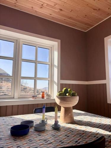 a room with a table with a bowl of fruit on it at Jóhannshús- tradational Icelandic house in Hrepphólar