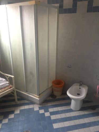 a bathroom with a shower and a toilet at CASA RUIINS in Torre Annunziata