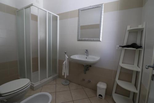 a bathroom with a toilet and a sink at Villetta Amelie a Otranto in Otranto