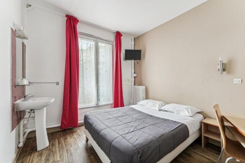 a bedroom with a bed and a sink and red curtains at Hotel Tolbiac in Paris