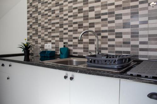 Kuchyň nebo kuchyňský kout v ubytování Casa Amarela - Conforto e localização central!