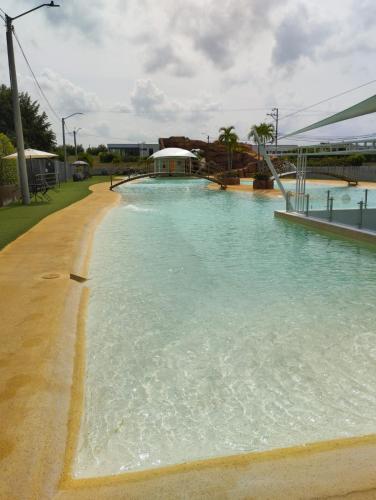 a large pool of water with a slide in it at Casa Sentido - Tu refugio campestre in Alvarado