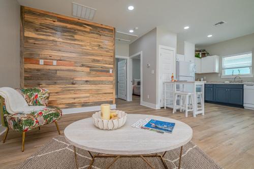 a living room with a table and a kitchen at The Oasis Resort in Rockport