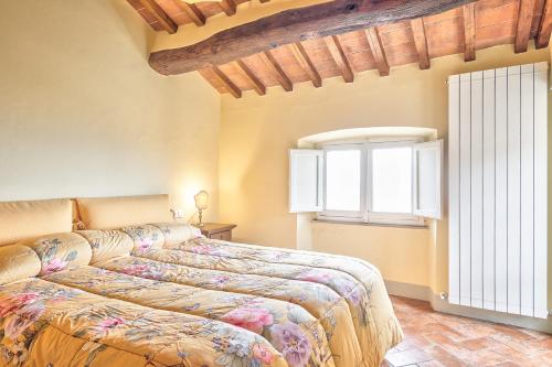 a bedroom with a bed and a window at La Terrazza - Together in Tuscany in Cortona