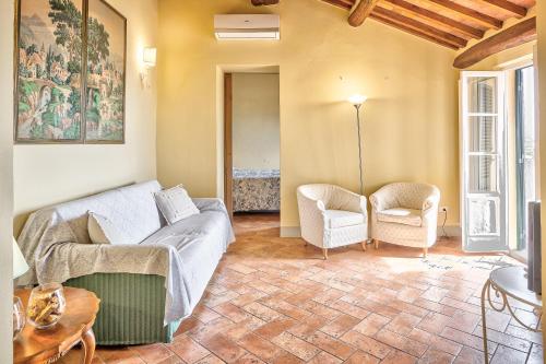 a living room with a couch and two chairs at La Terrazza - Together in Tuscany in Cortona