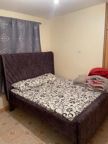 a bed sitting in a room with a mattress at Tawakal airbnb in Thika