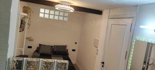 a small room with a bed and a window at Malaga jacuzzy in Málaga