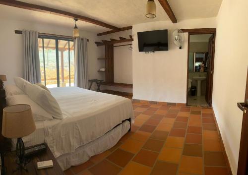 Et tv og/eller underholdning på Cabaña Don Berna Barichara