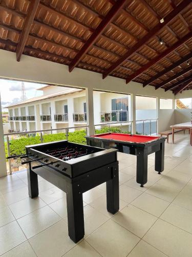 two ping pong tables sitting on a floor in a room at Pousada Kalunga in Flecheiras