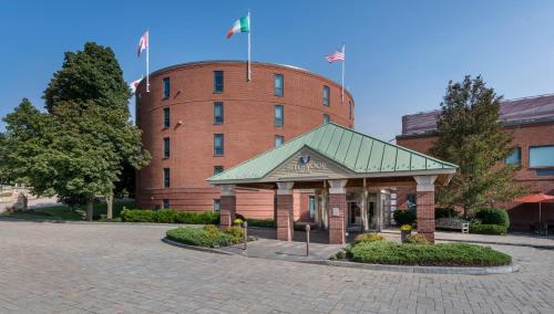 a building with two flags in front of it at Beechwood Hotel in Worcester