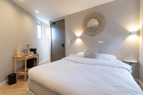 Letto o letti in una camera di SAYŌ Boutique Hotel