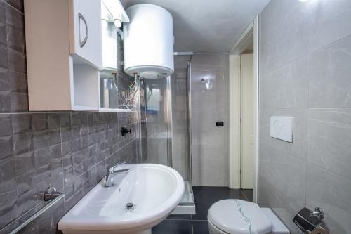 a bathroom with a white sink and a toilet at Villa Gaudì - Mallorca in Sant'Isidoro